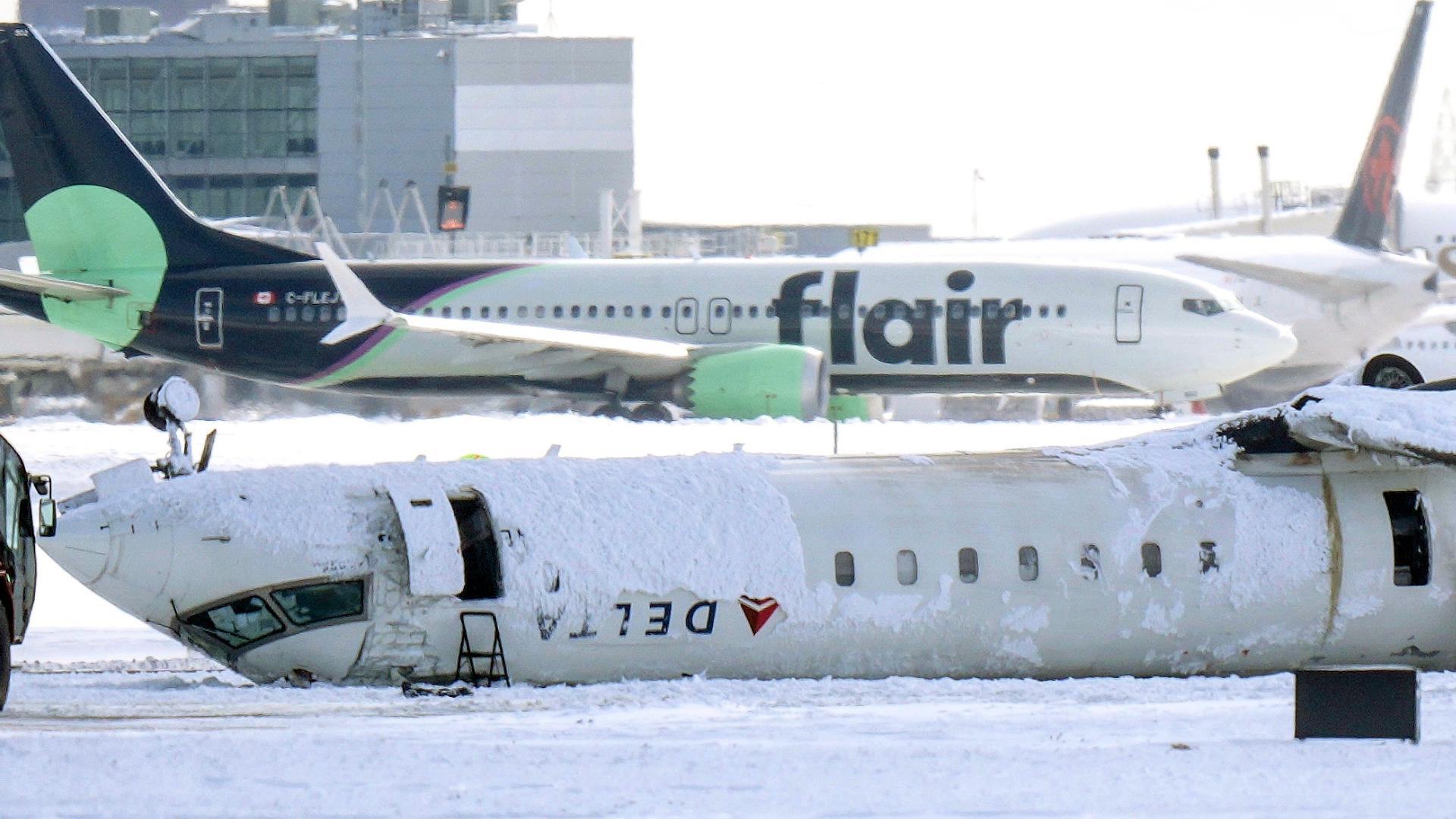 A video filmed from a nearby plane captured the moment the Delta Air Lines jet flipped over during a crash landing. Miraculously, all 80 people on board survived.