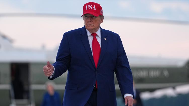 Trump puts new Russia sanctions passed by Congress on hold, saying waiver is in US national interest
