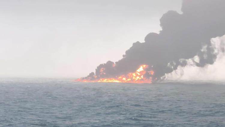 A cargo ship hits a tanker and they catch fire off England. The crew members are safe