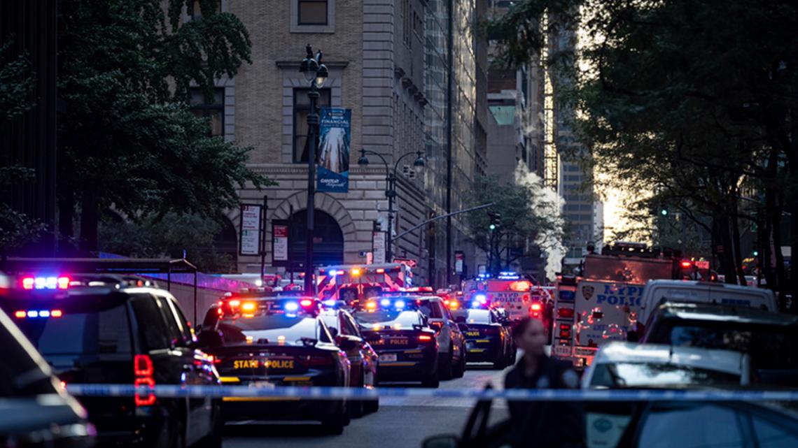 Read Gunman kills 4, including police officer, in shooting at New York City office tower