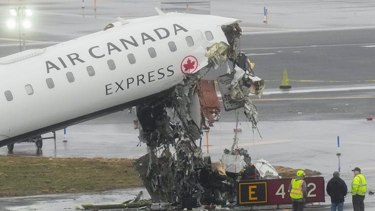 Two LaGuardia air traffic controllers left work early before deadly crash, AP source says