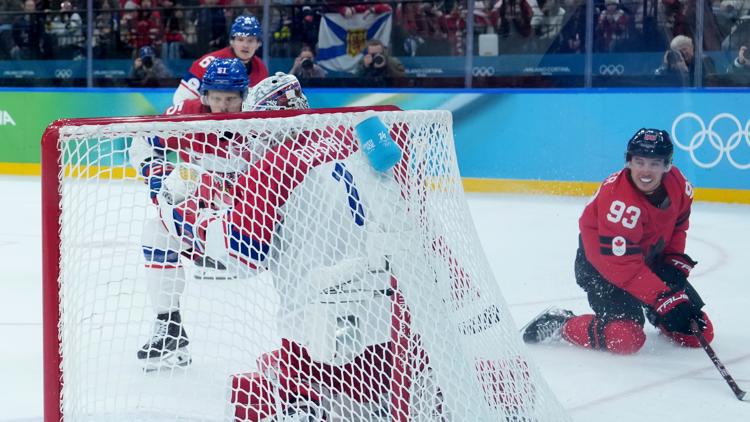 Canada's Mitch Marner (93) during the overtime period of a men's ice hockey quarterfinal game at the 2026 Winter Olympics, Feb. 18, 2026.