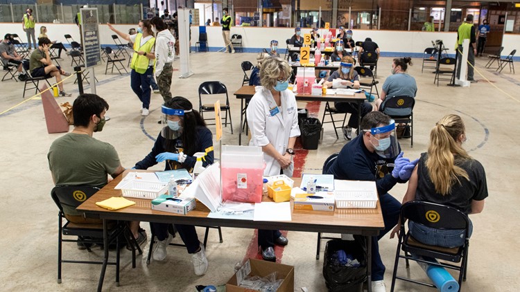 US colleges divided over requiring student COVID-19 vaccinations