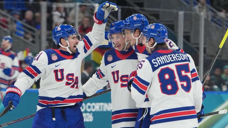 Tage Thompson, second right, celebrates after scoring the U.S.'s fourth goal against Germany at the 2026 Winter Olympics. (AP Photo/Carolyn Kaster)