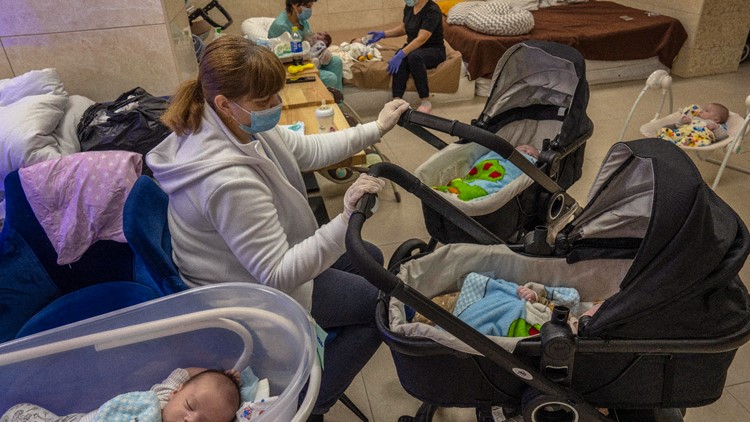 Surrogate babies born in Ukraine wait out war in basement