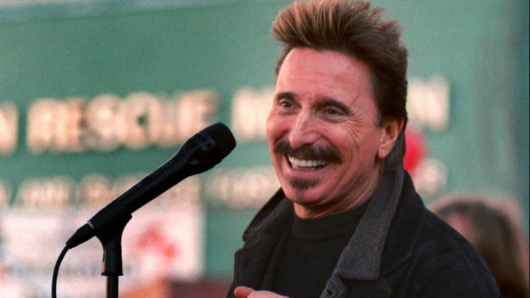 Chuck Negron, former lead singer of Three Dog Night, sings during a Christmas Eve party, Dec. 24, 1997, in Los Angeles. (AP Photo/John Hayes, File)