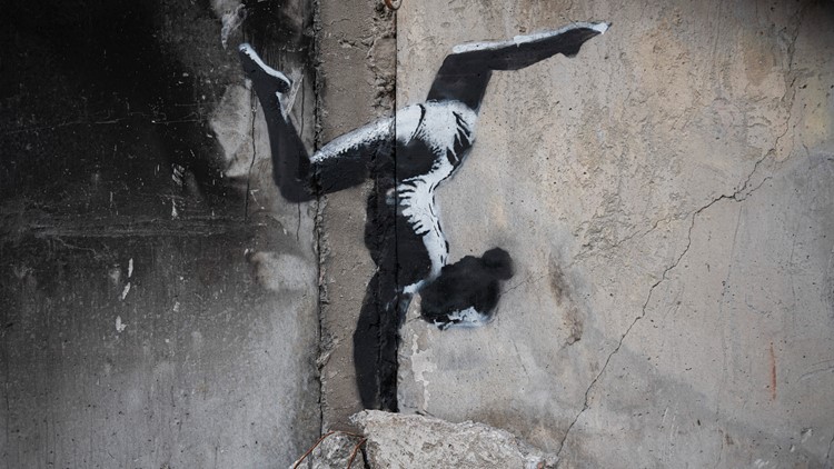 Banksy unveils mural on destroyed building in Ukraine