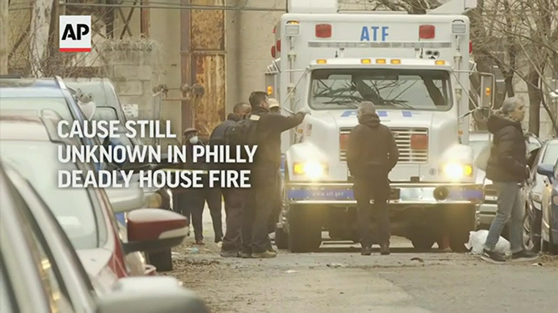 City and federal investigators are working to determine the cause of a blaze that killed 12 people in a Philadelphia rowhome.