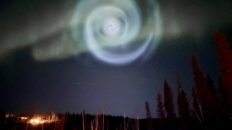 Odd spiral appears amid northern lights in Alaska night sky Odd spiral appears amid northern lights in Alaska night sky