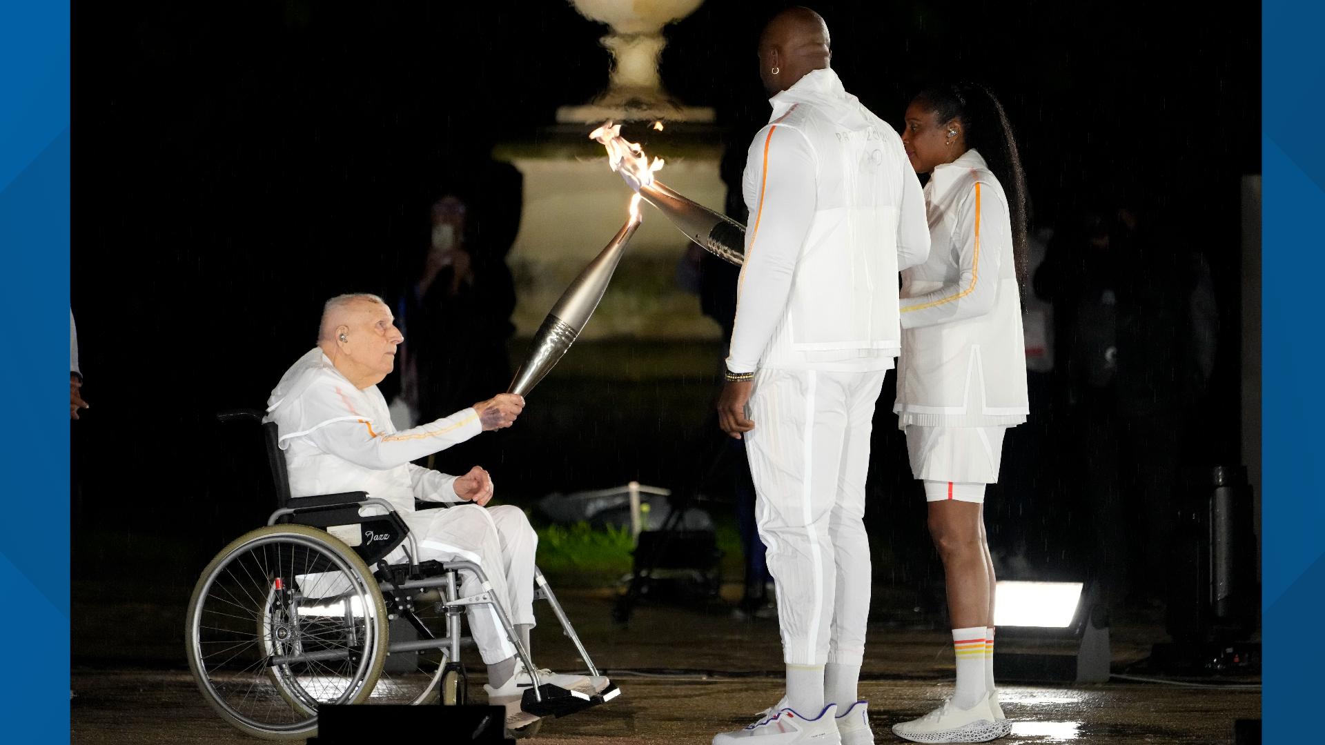 Who lit the torch at the 2024 Olympics