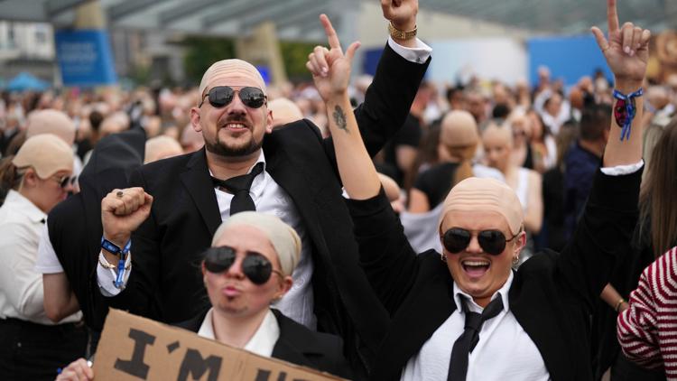 FILE - Fans gather in front of the O2 Arena prior to a performance by Pitbull on Monday, June 9, 2025, in London.