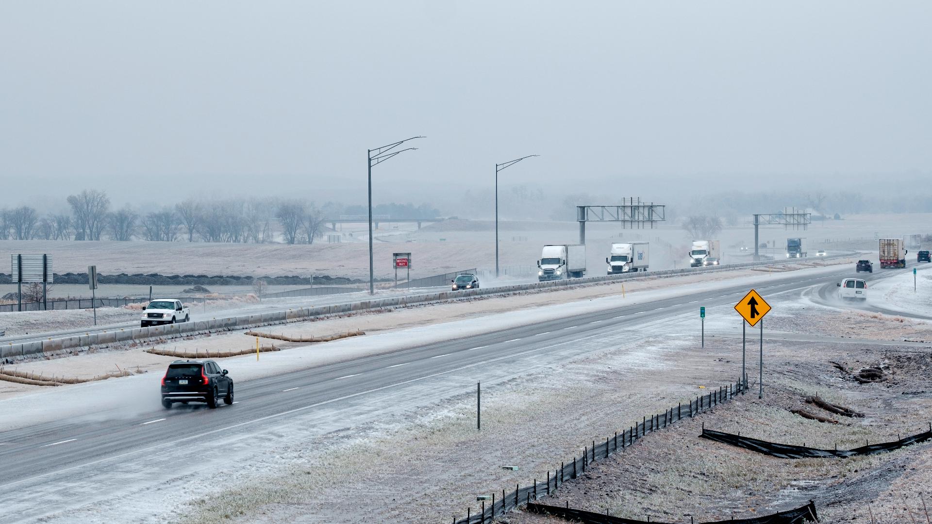 Storms across US bring heavy snow, dangerous ice and rare tornado in