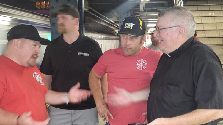 A Minnesota priest who helped save firefighters on 9/11 is back in New York City