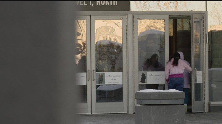 Despite deadly shooting, shoppers still show up for last-minute shopping