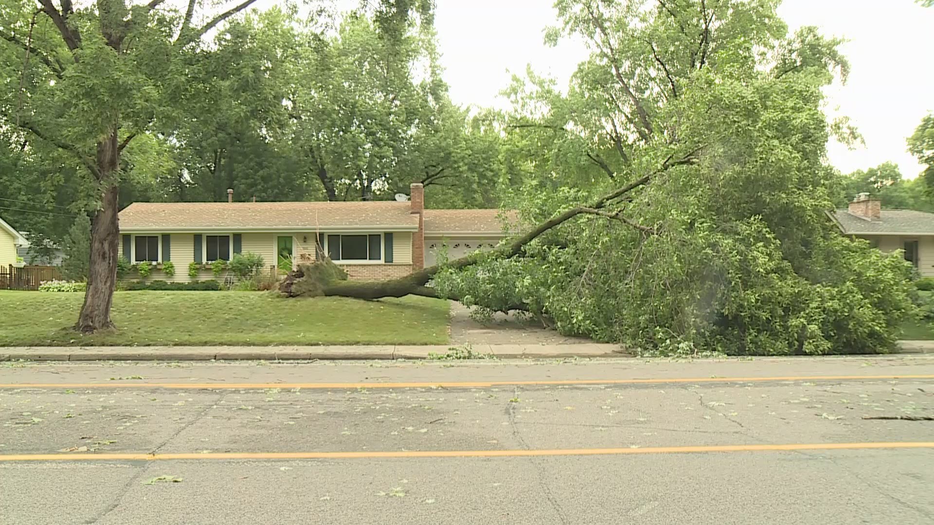 The city of Bloomington is cleaning up after a violent storm that damaged trees, homes and cars, and left thousands without power.
