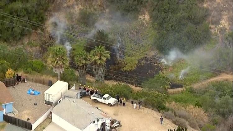 Fire crews battle brush fire in Clairemont neighborhood in San Diego