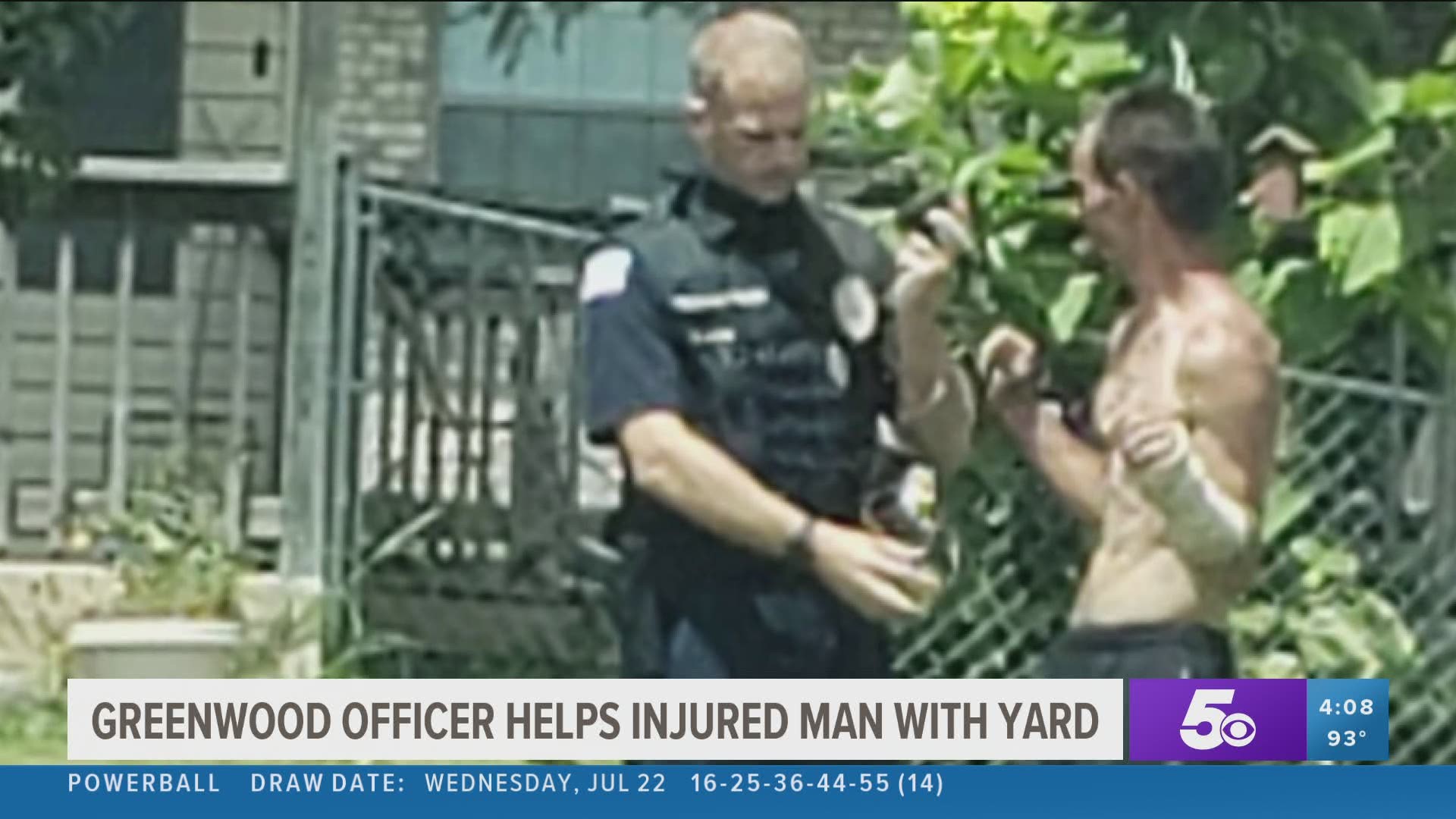 Greenwood officer helps an injured man with his yard work.