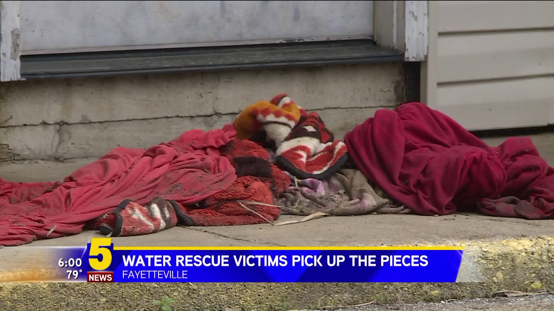 Water Rescue Victims Pick Up The Pieces