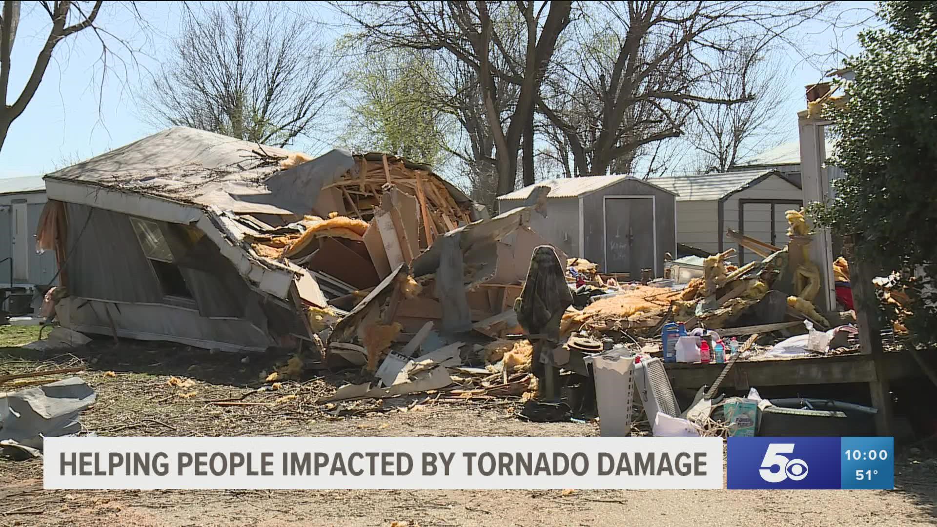 Residents and volunteers helped clean up the tornado damage at Woodbridge Estates Mobile Home Park in Springdale.