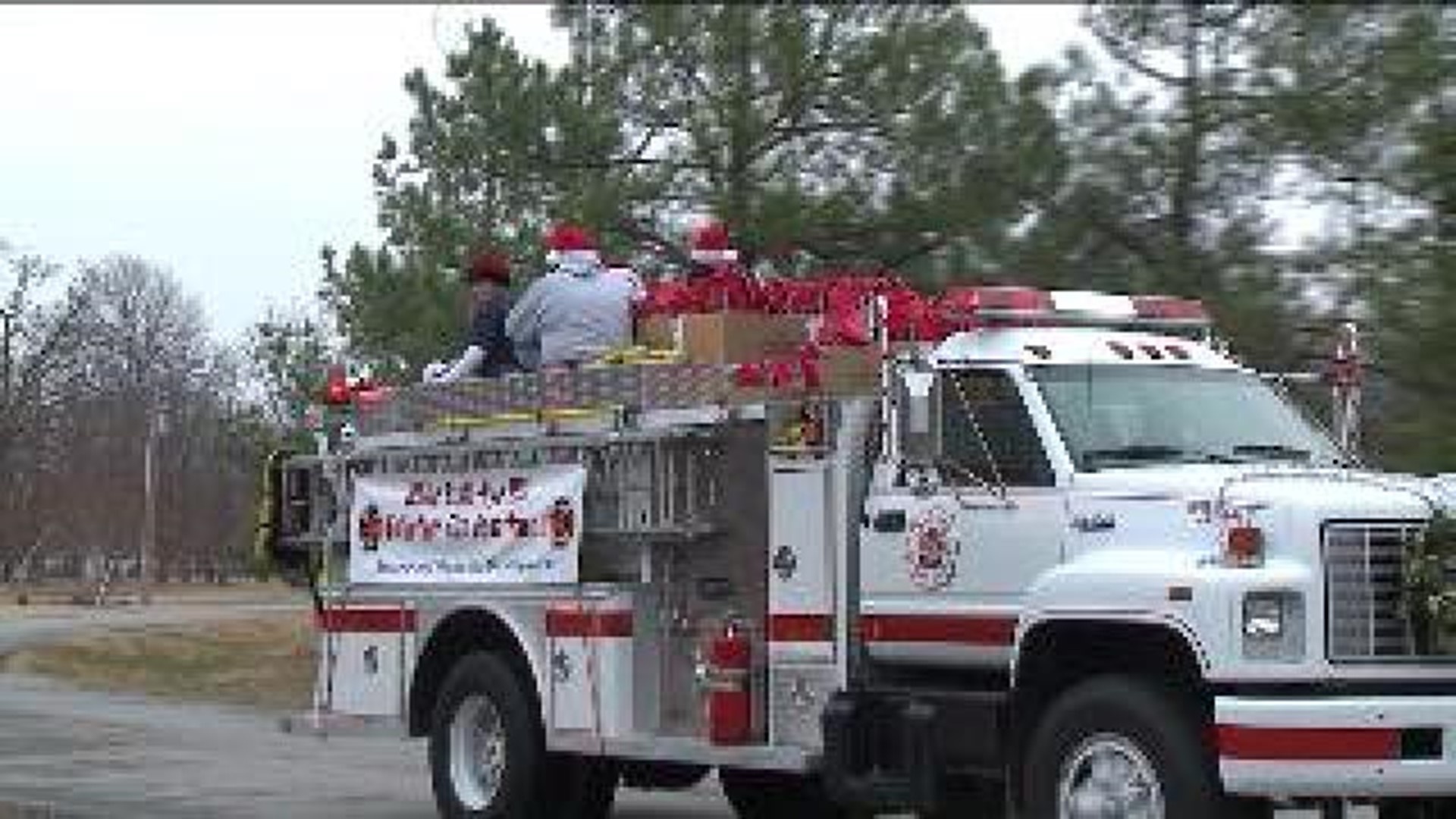 Volunteer Firefighters Help Santa