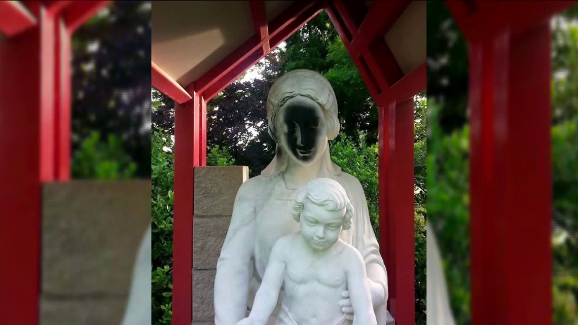 Statue Of Mary Vandalized, Name of Voodoo Goddess Taped To Shrine