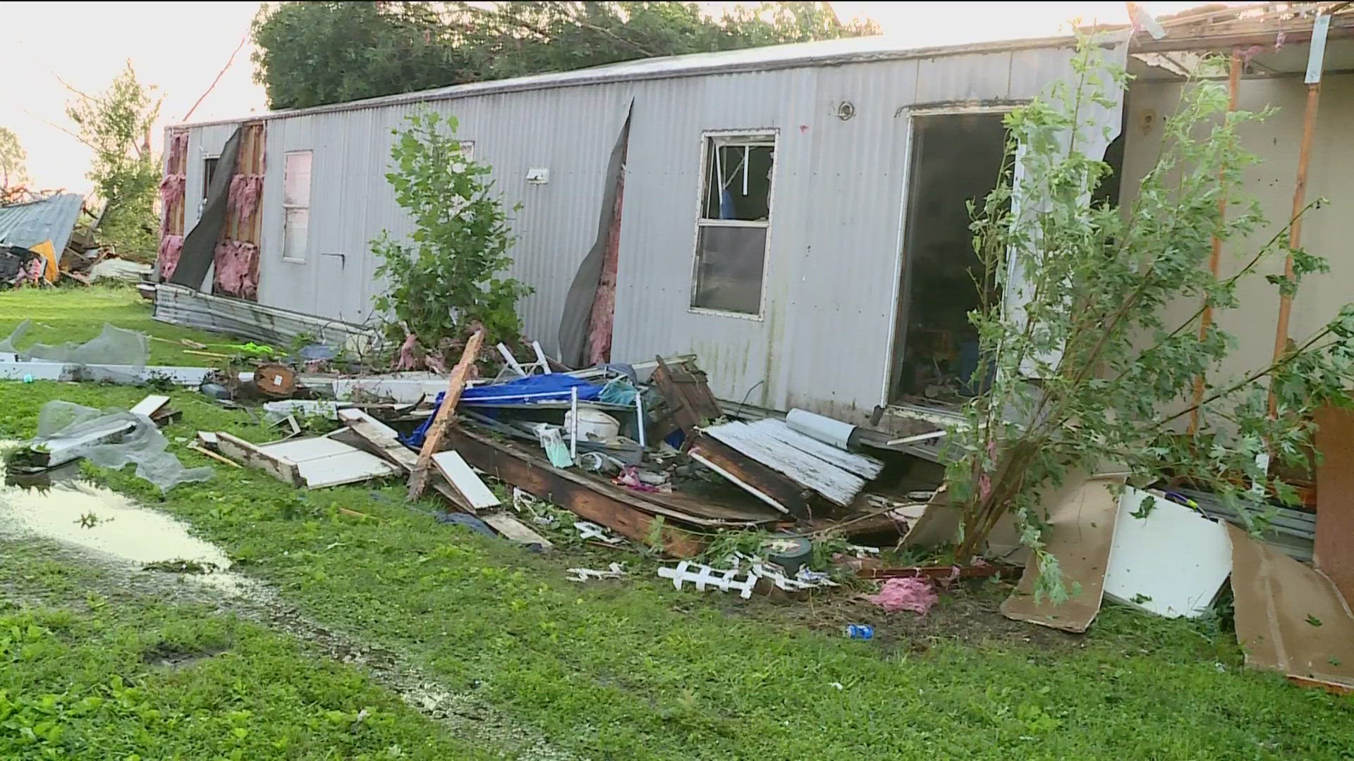 Storms moved one trailer home to the other side of the street, leaving the husband and wife who were inside in critical condition.