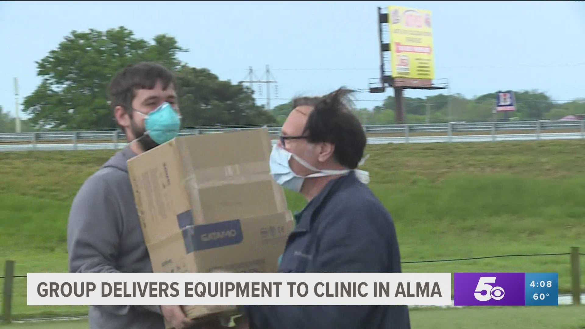 Group delivers medical equipment to clinic in Alma