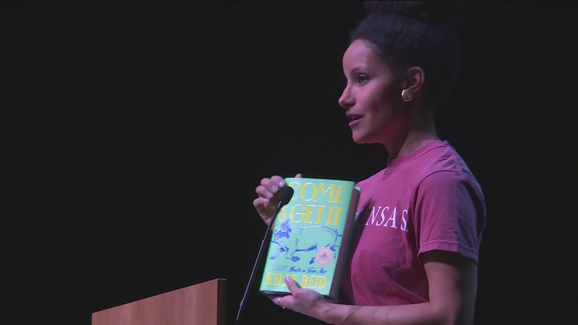 THE AUTHOR OF A NEW BOOK SET AT THE UNIVERSITY OF ARKANSAS MADE A STOP IN FAYETTEVILLE TONIGHT