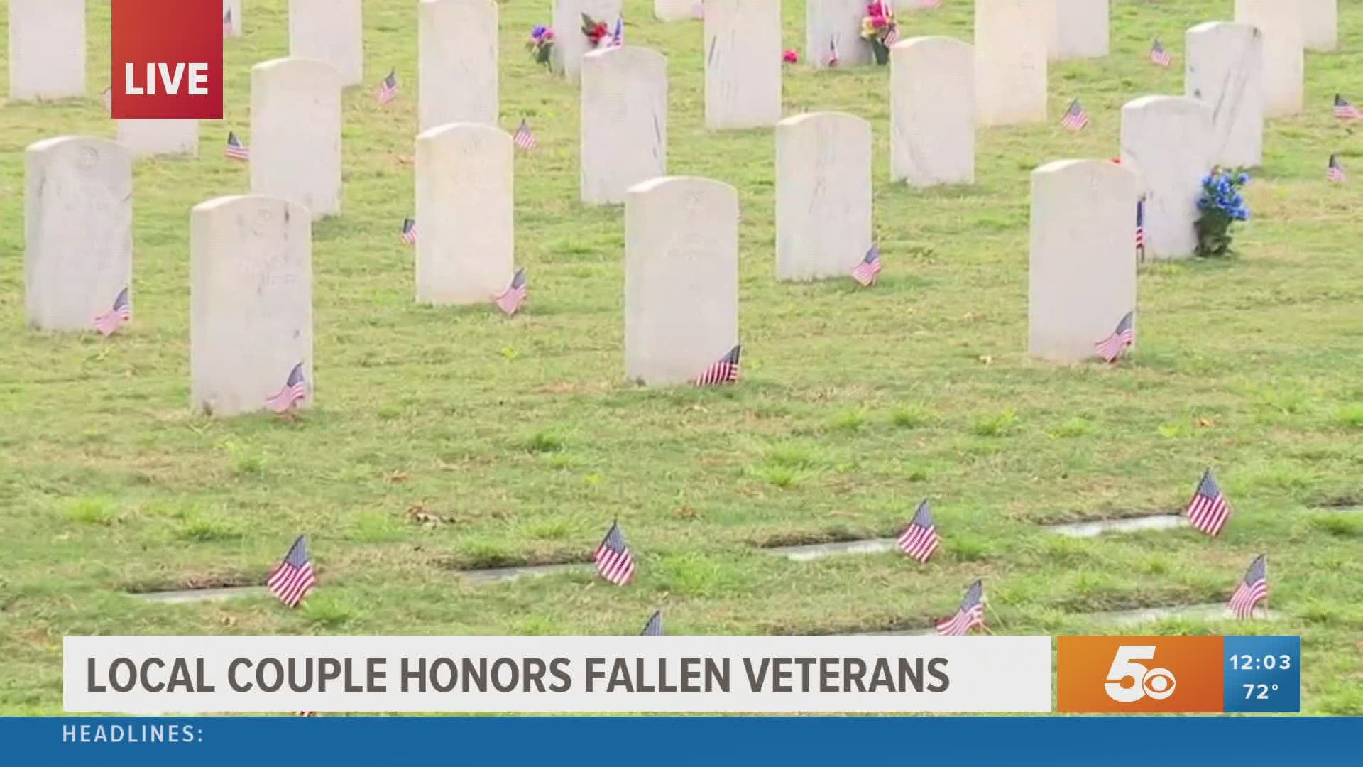 A retired Army Colonel and his wife bought flags to place on the tombstones at the National Cemetary.