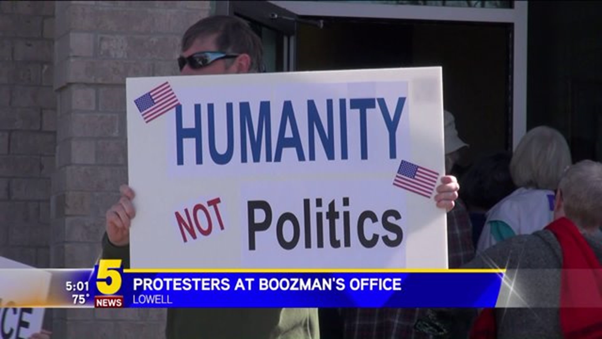 PROTESTERS OUTSIDE OF BOOZMAN`S OFFICE
