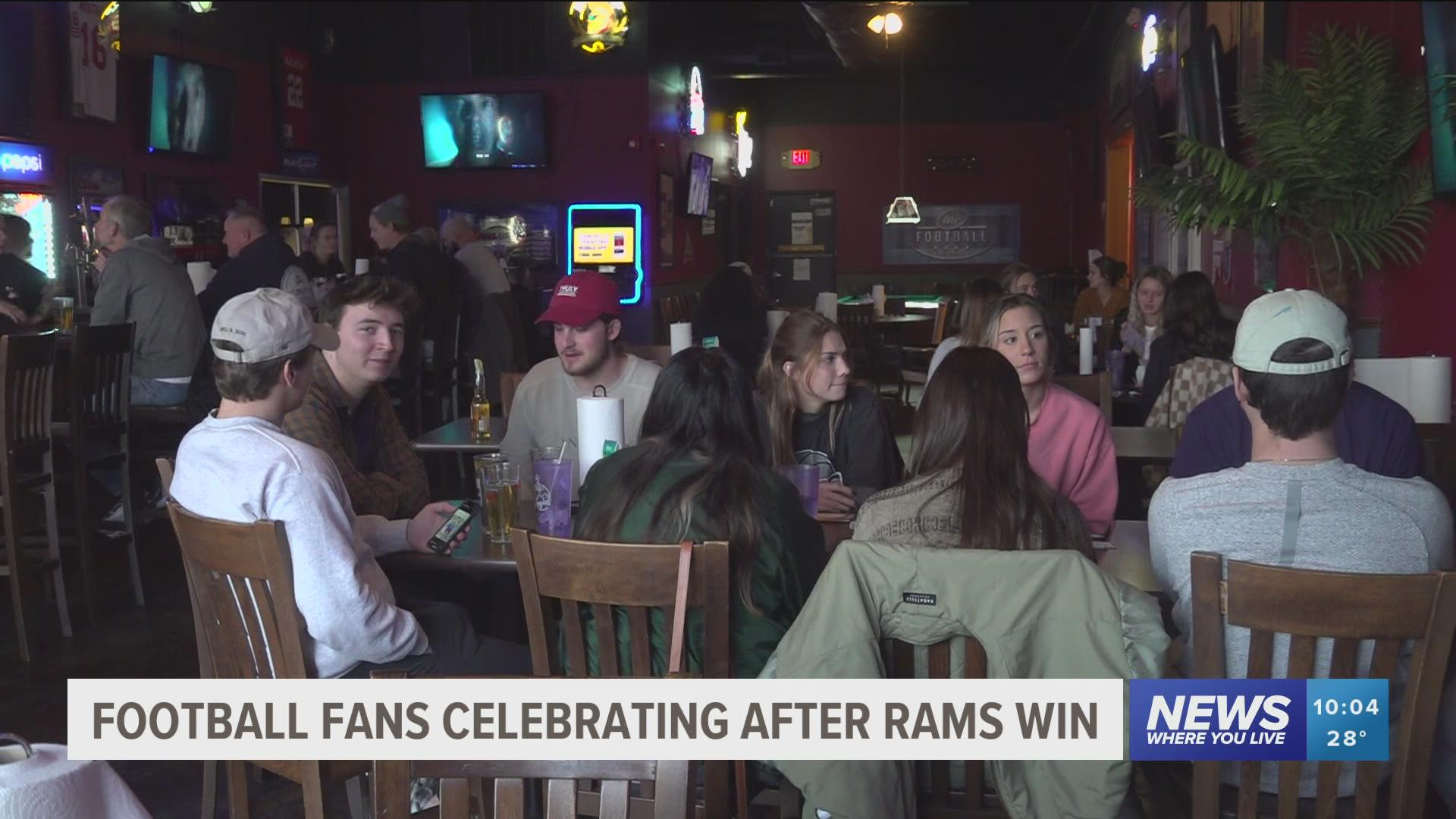 Local football fans celebrate after the Rams win the Super Bowl.