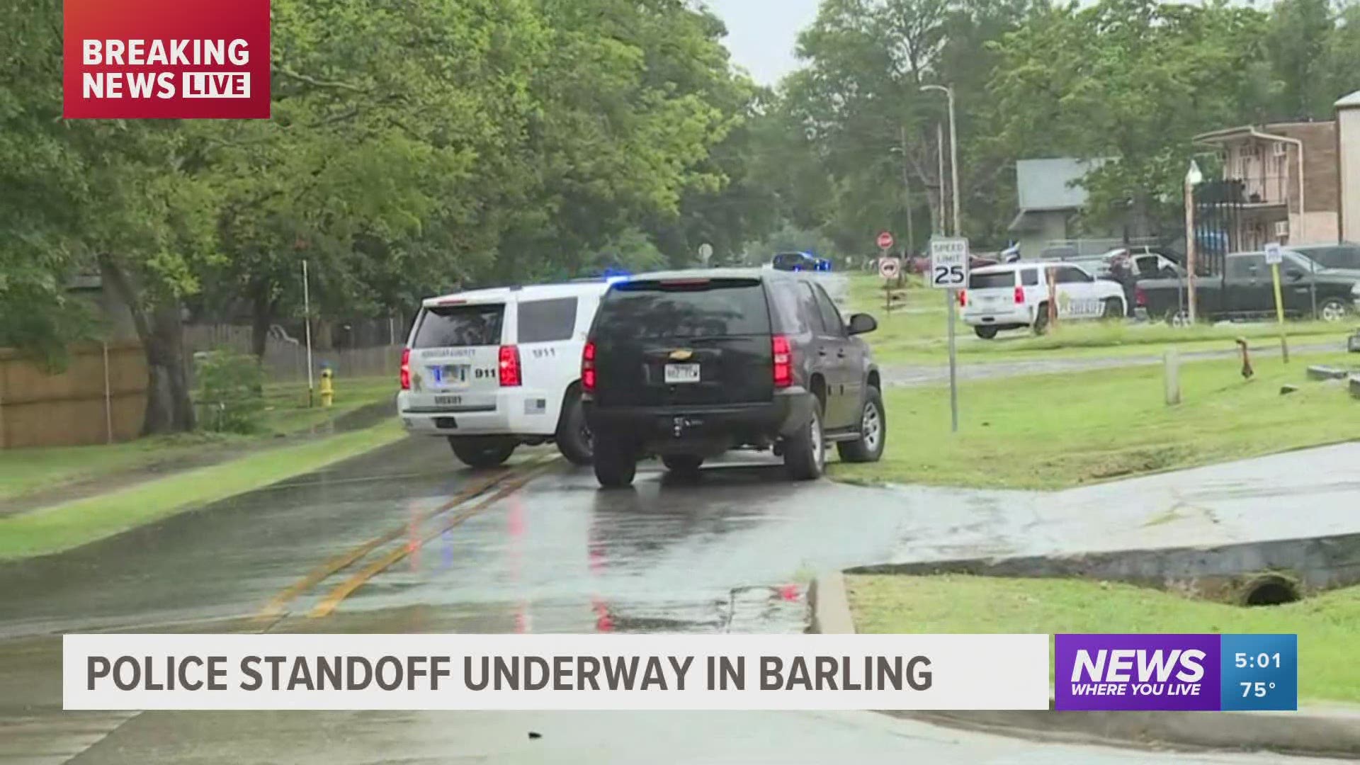 Authorities in Barling have their guns drawn after a subject barricaded himself inside a home near Big A's convenience store.