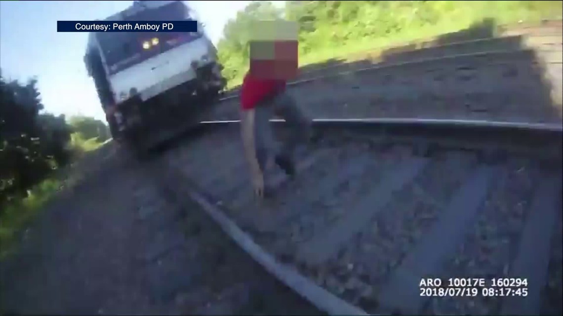 Bodycam Video Shows Rookie Cop Saving Man From Oncoming Train ...