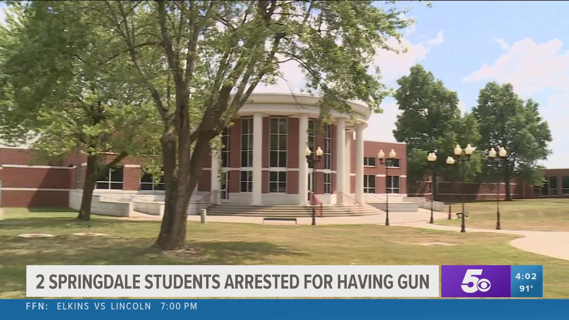 The school district said the gun was immediately confiscated and two students were arrested without incident.