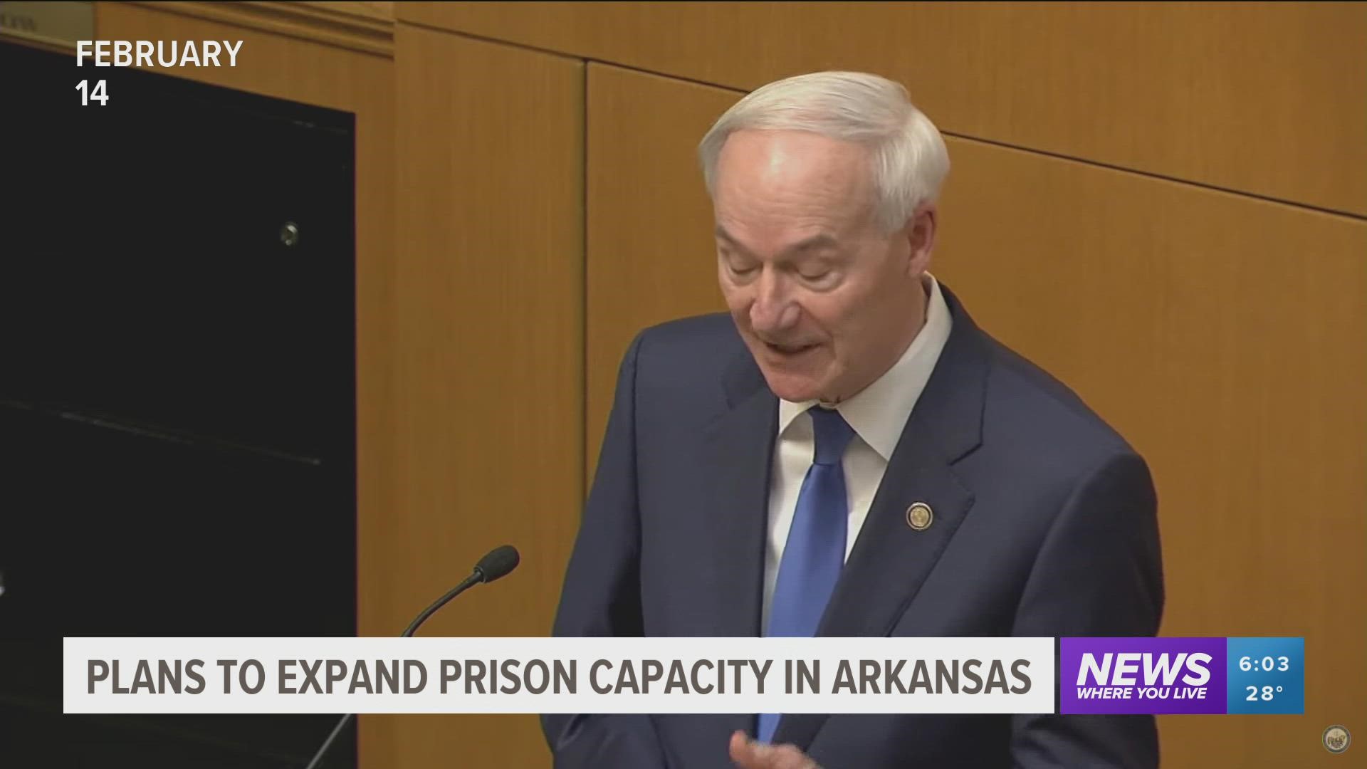 Gov. Asa Hutchinson expressed his support for the decision to expand an inmate facility despite protests shouting "no new cages" in response.