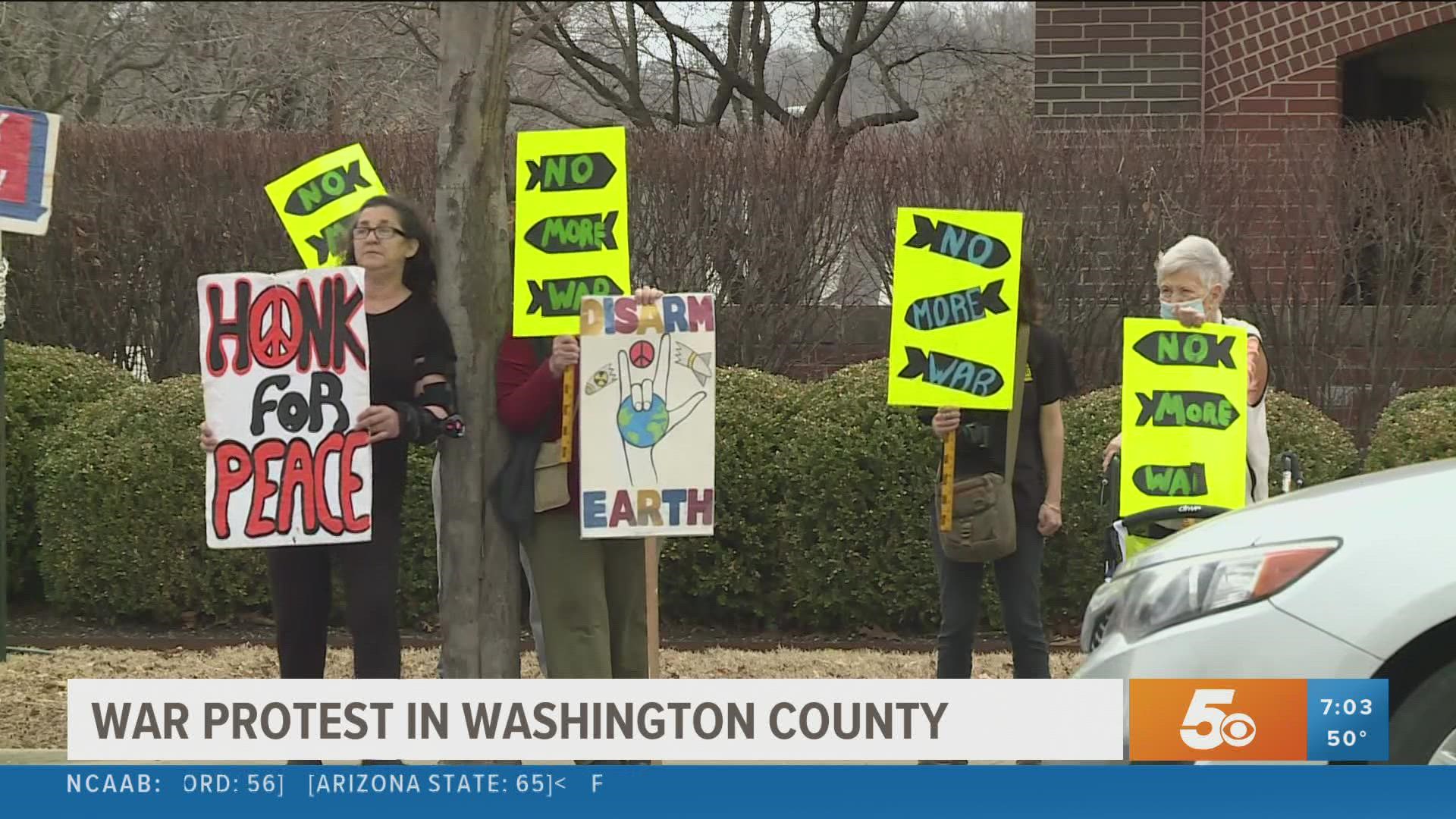 Dozens of people gathered in front of the Washington County Courthouse Saturday, March 5, to protest war across the world.