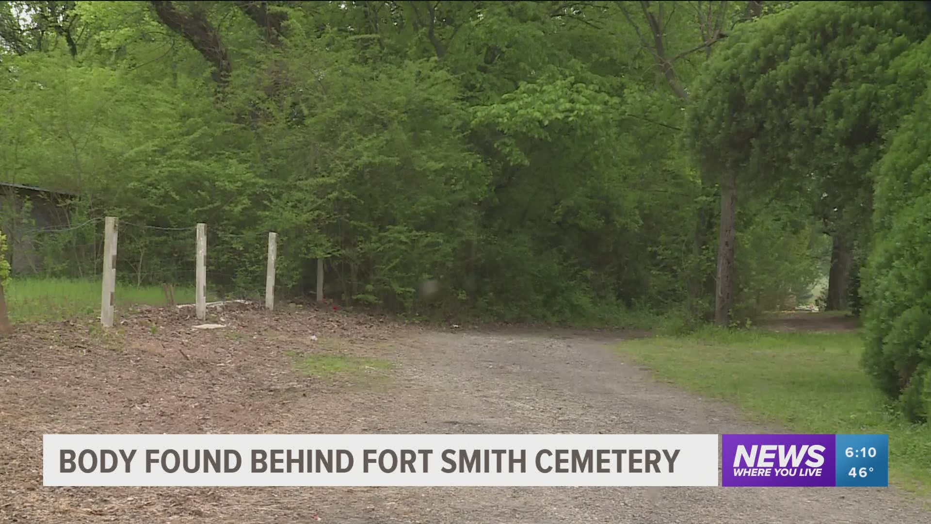 A body was found behind a Fort Smith cemetery on Friday.