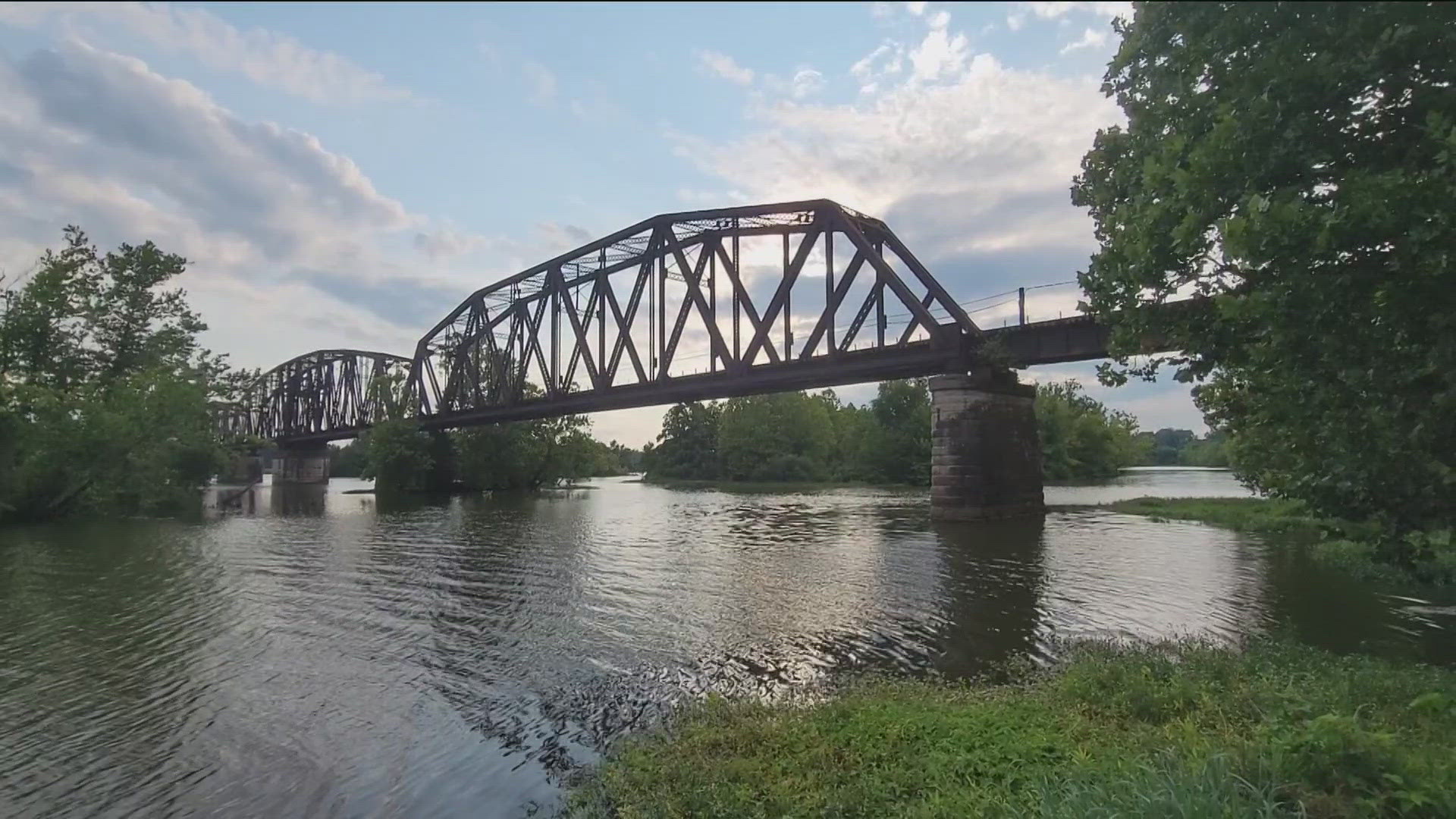 Van Buren police said three people were on the train bridge taking photos on Saturday night when the train came over the bridge and struck them.