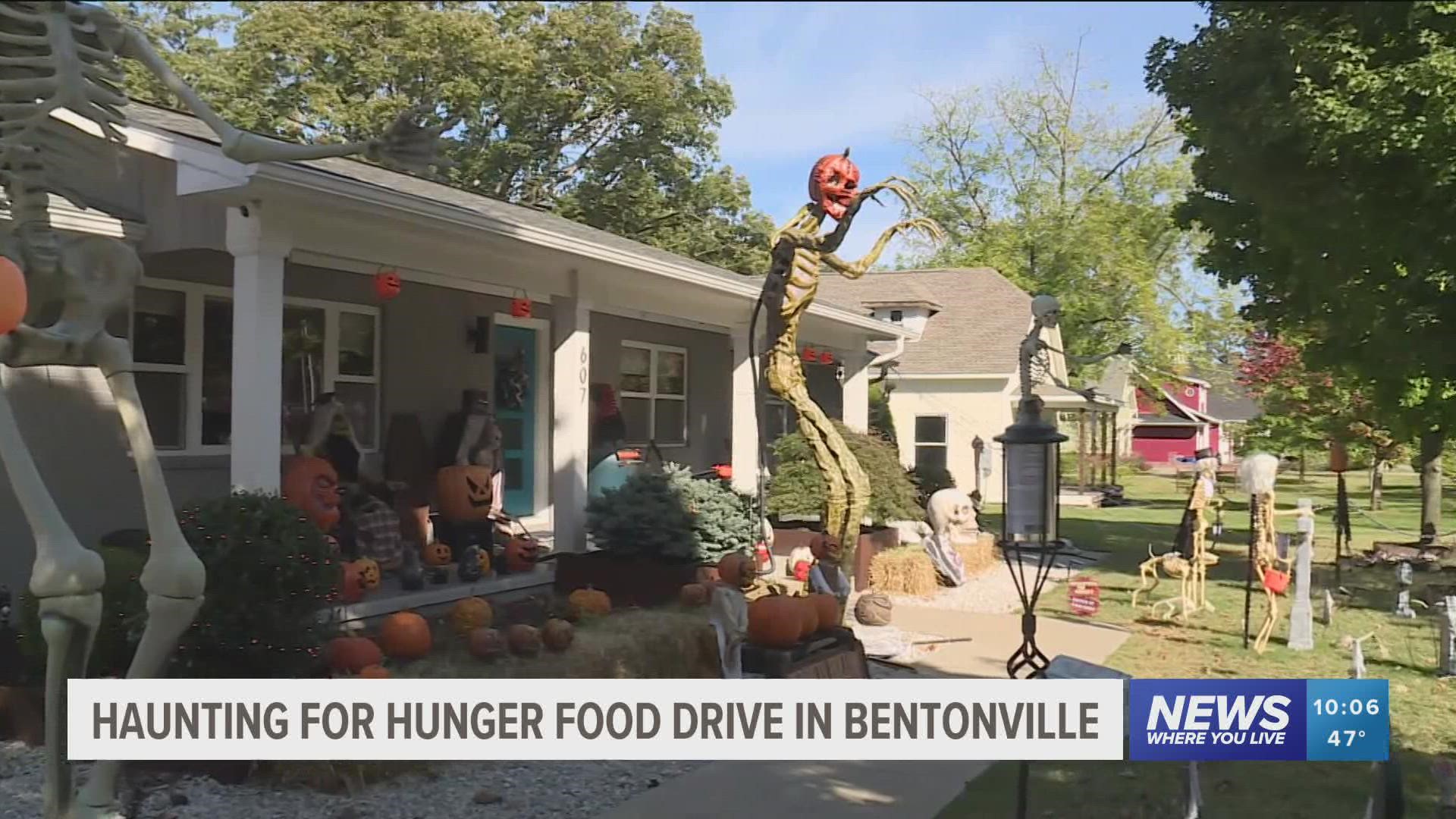 A Bentonville couple is using their large Halloween display to encourage people to donate to fight food insecurity.
