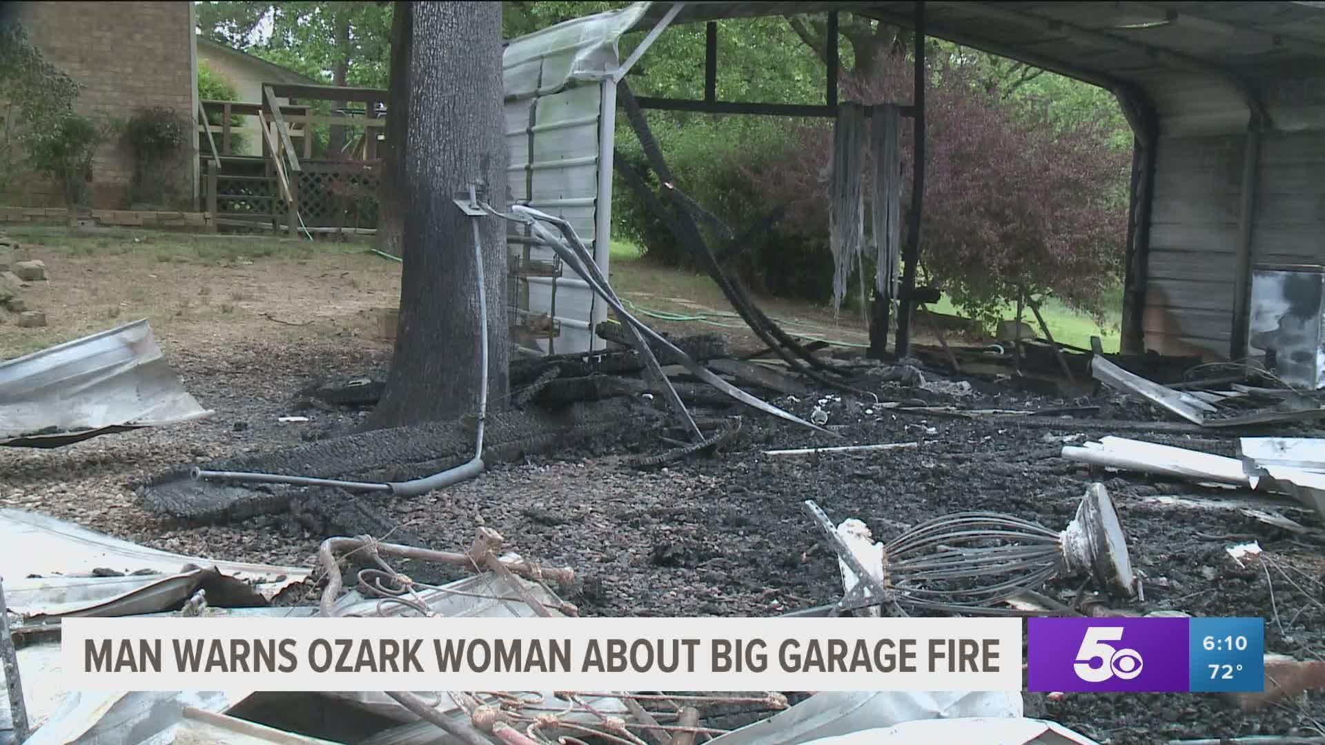 A man driving down Interstate 40 in Ozark is being called a hero today after he told a woman her garage was on fire.