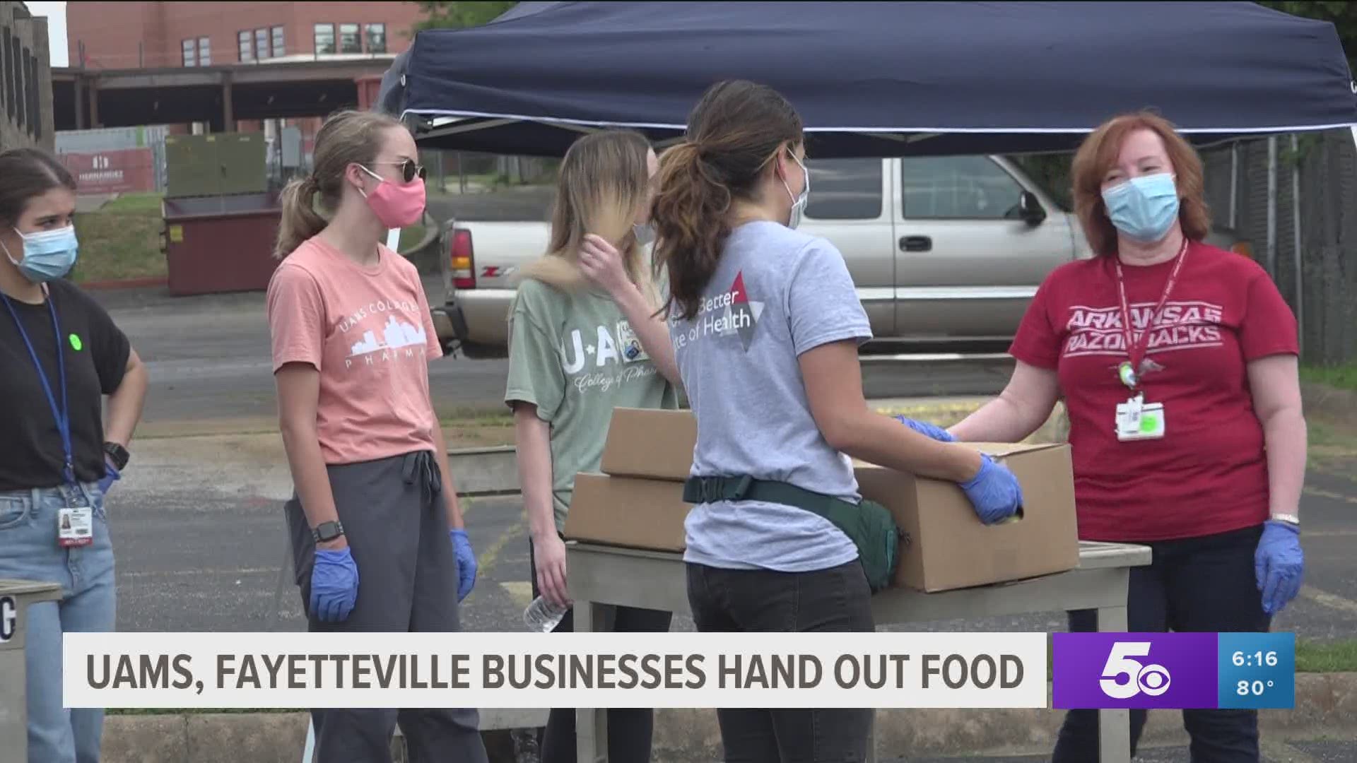 UAMS, Fayetteville businesses hand out food.