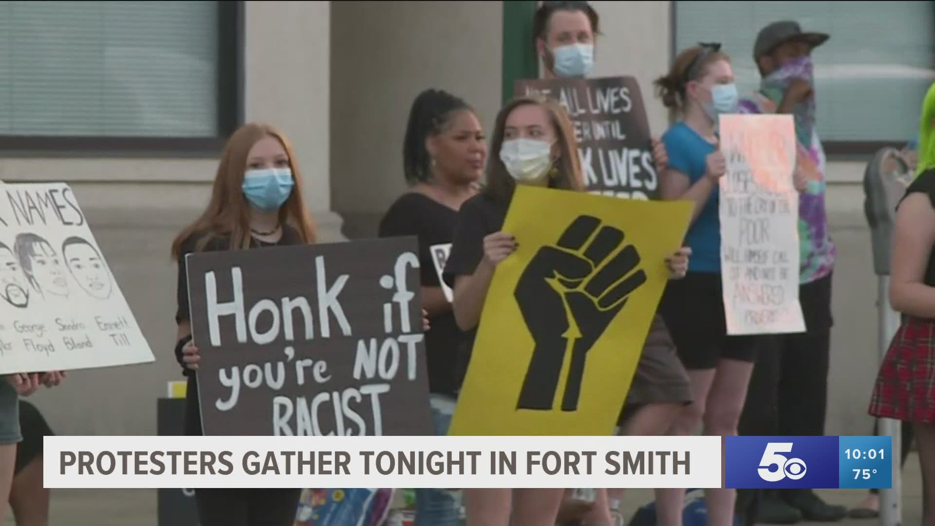 Protesters gather tonight in Fort Smith.