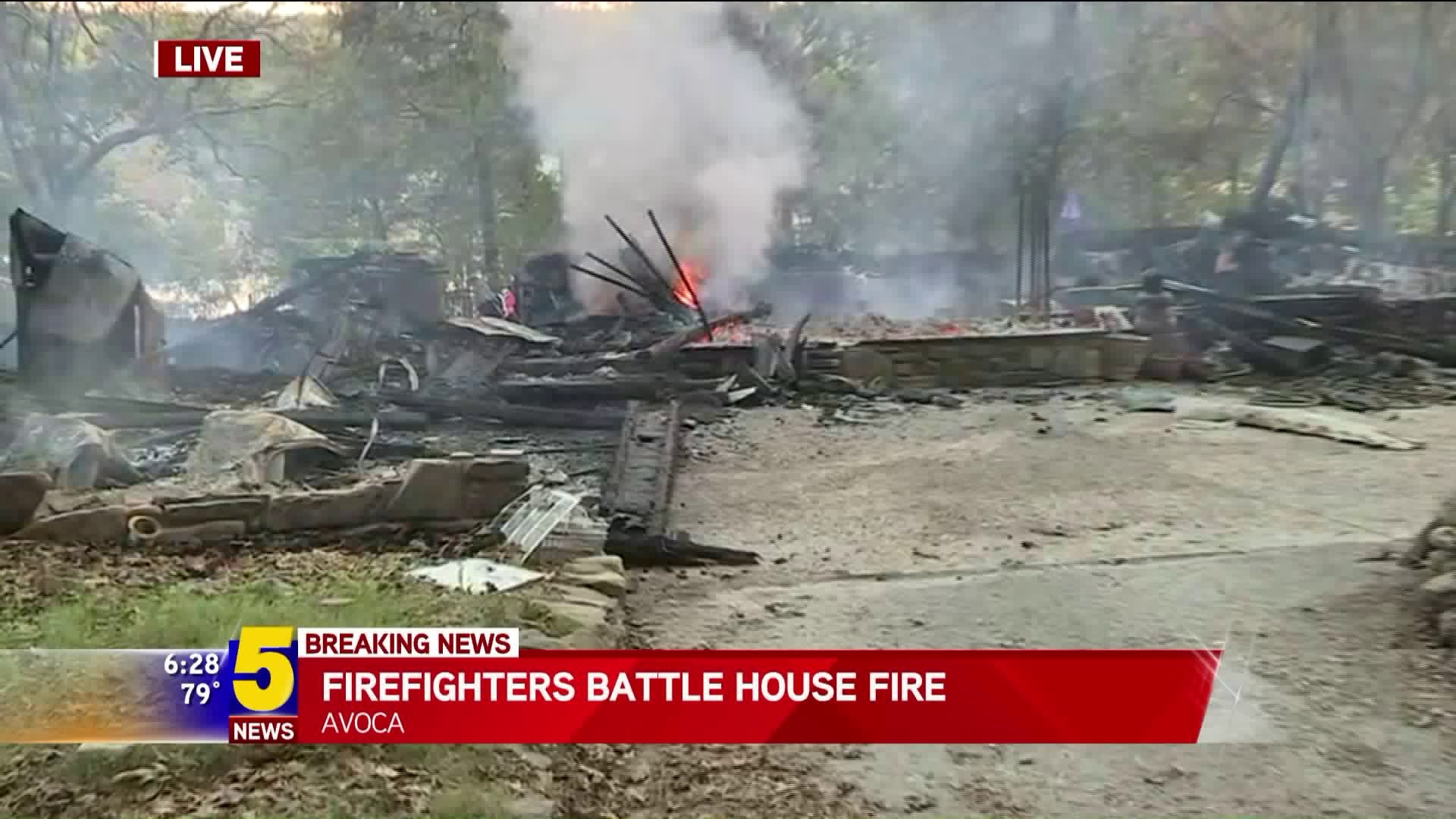 Firefighters Battle House Fire
