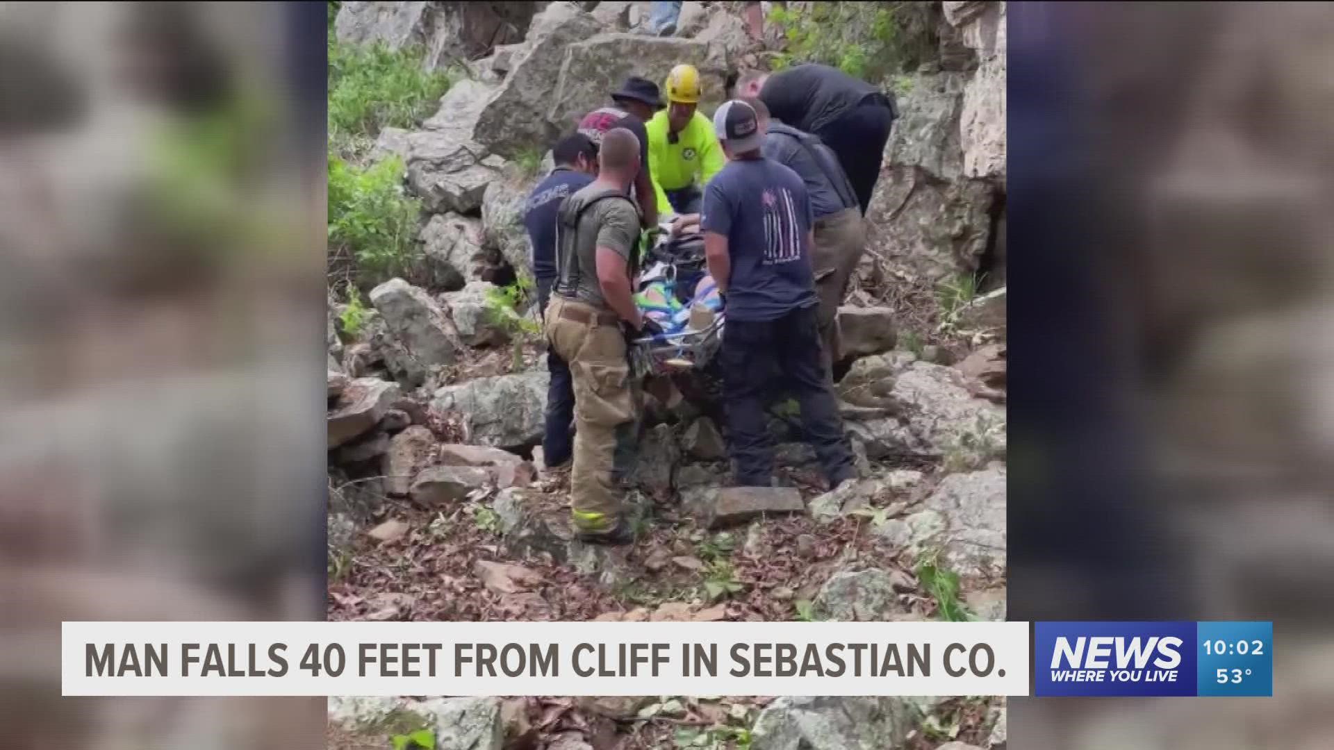 Crews pulled a man up a cliff to safety after he fell down about 40 feet hitting a branch halfway.