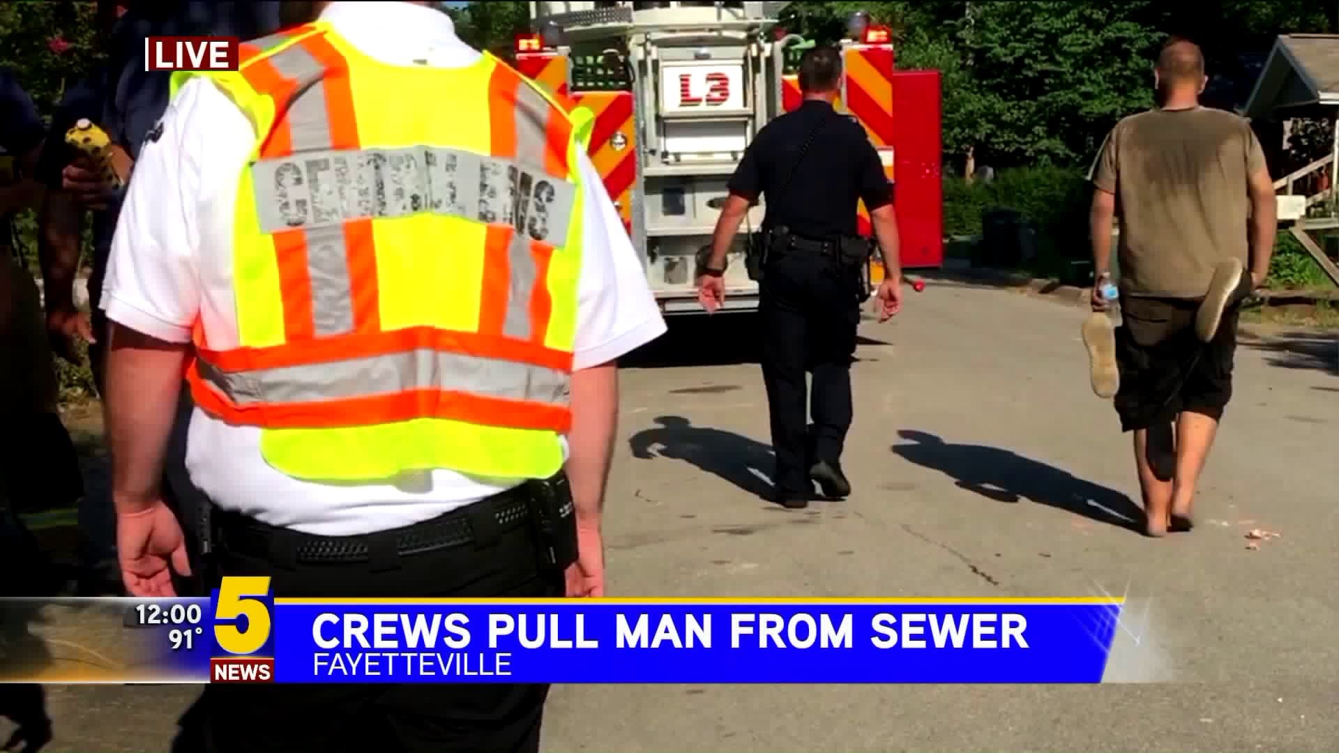 Firefighters Pull Man From Sewer