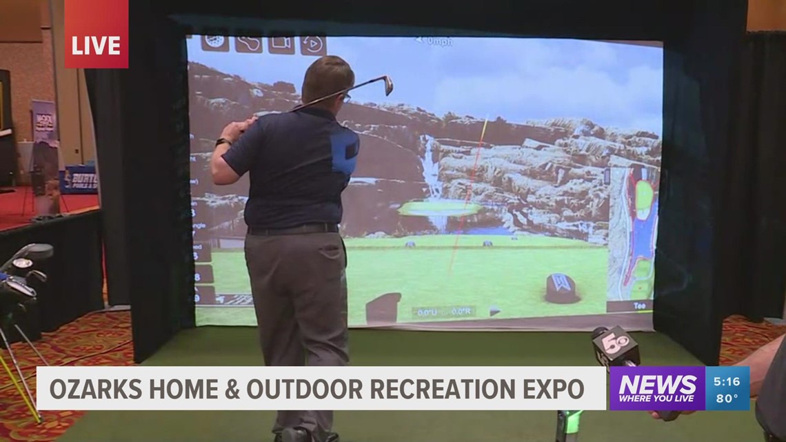 Daren Bobb enjoys golf simulator at Ozarks Home & Outdoor Expo in Rogers