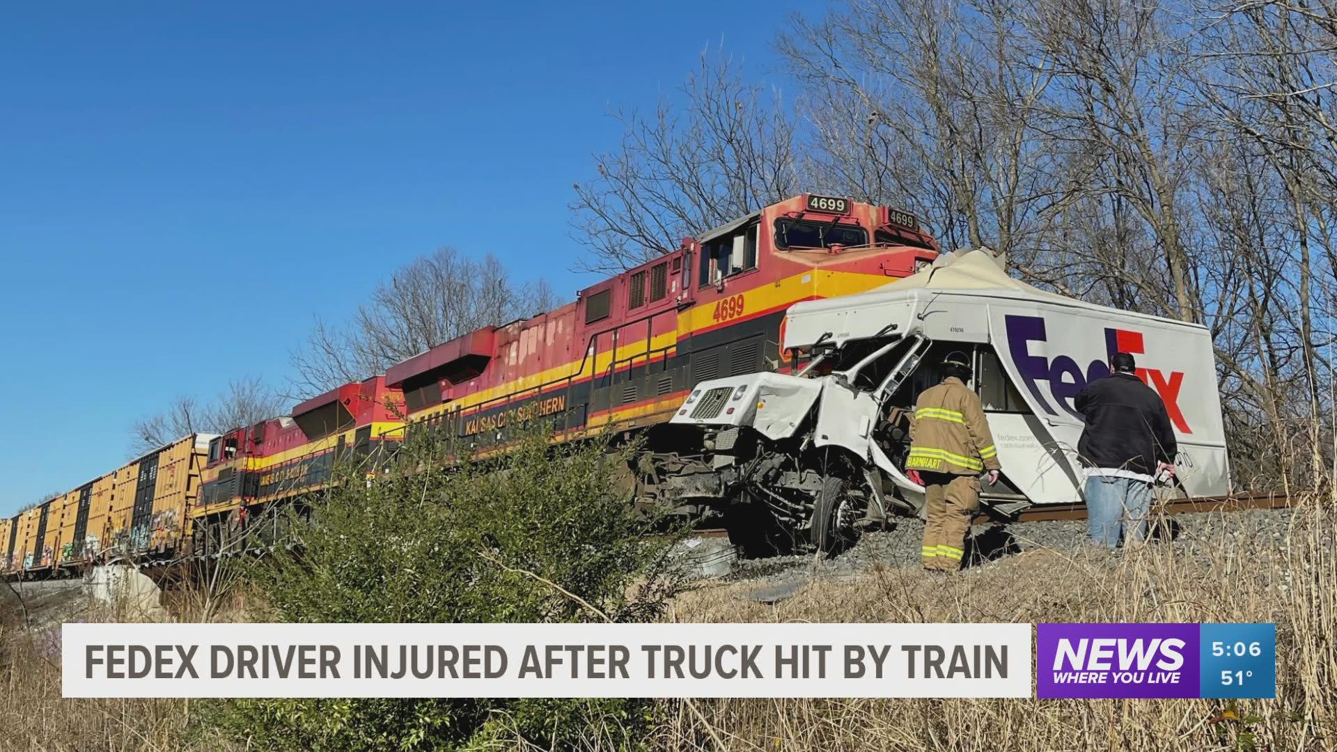 Poteau police say the 24-year-old driver was crossing railroad tracks when the truck was struck by a southbound Kansas City Southern train.