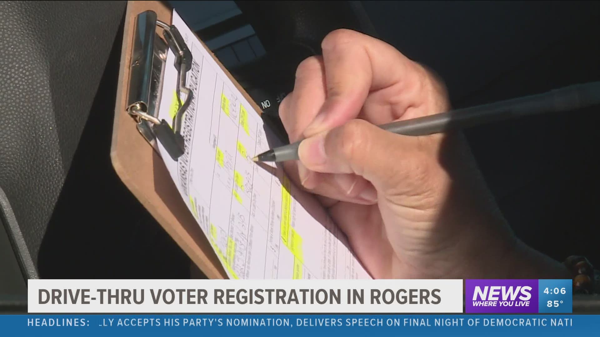 Drive-thru voter registration in Rogers.