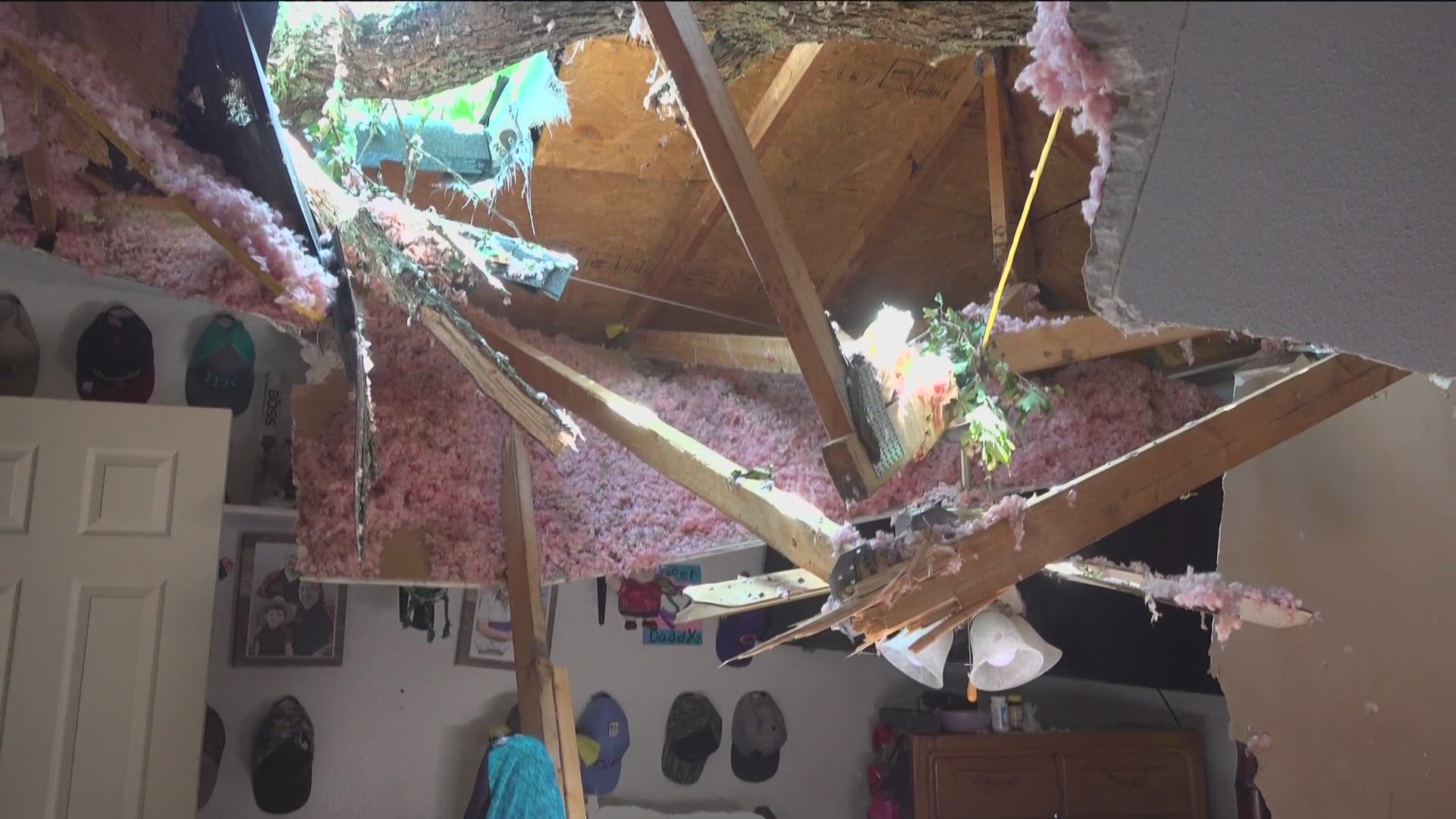 Minutes after one man got out of bed during Sunday's storms, his husband said a tree fell through their bedroom.