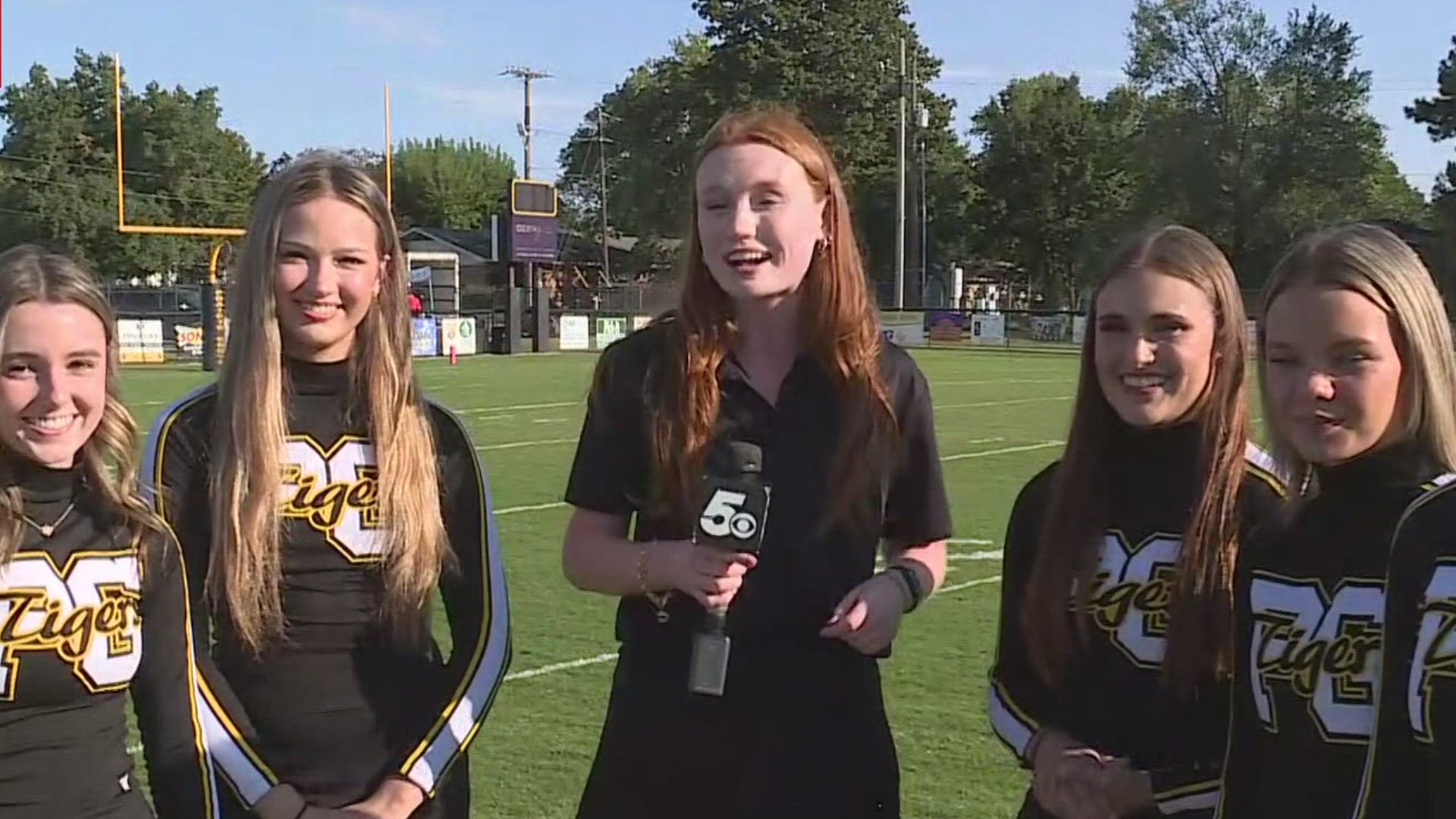 Prairie Grove cheerleaders prepare for the football game tonight against Pea Ridge.